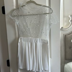 White romper with sheer top with glitter.